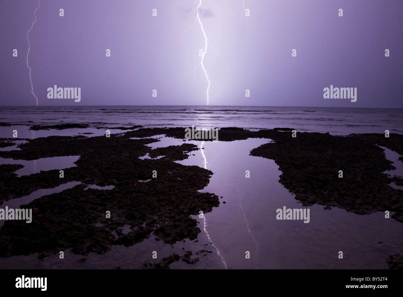 Lightning strikes the rocky Caribbean coast of Puerto Viejo de Talamanca in Limon Province, Costa Rica. Stock Photo