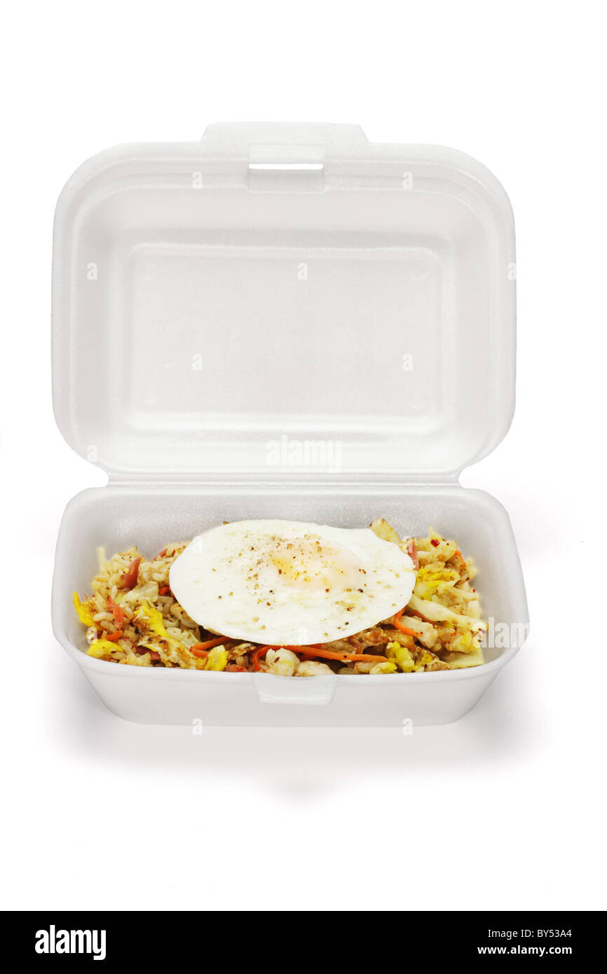 Fried rice and egg in open Styrofoam box on white background Stock Photo