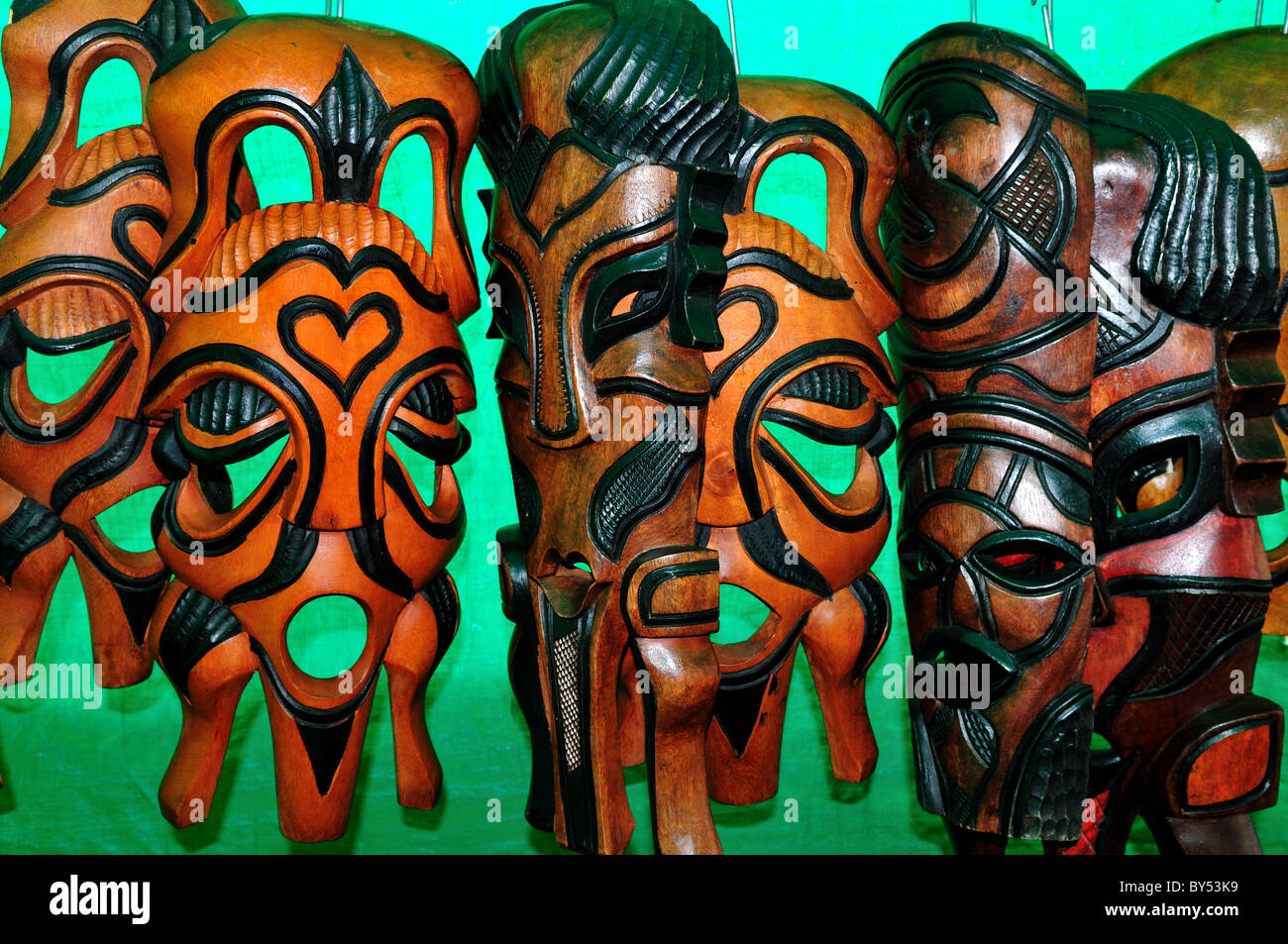 Wood carved masks for sale as souvenirs at the market. Cape Town, South