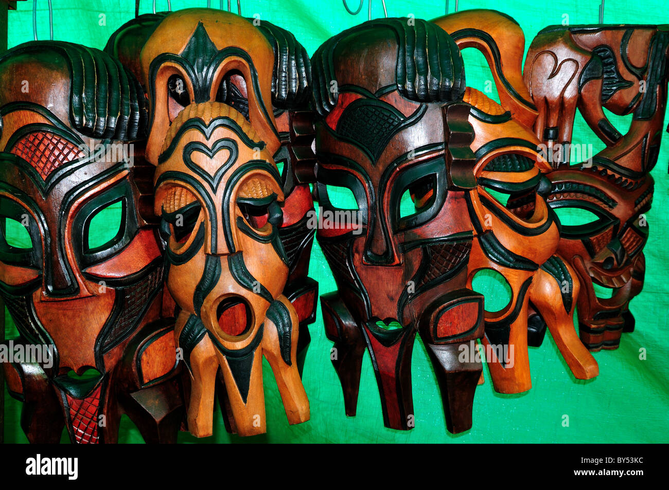 Wood carved masks for sale as souvenirs at the market. Cape Town, South