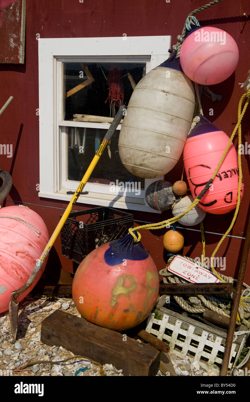 Buoy's and fishing gear hanging on a small house in Menemsha, Marthas Vineyard, Cape Cod, Massachusetts Stock Photo