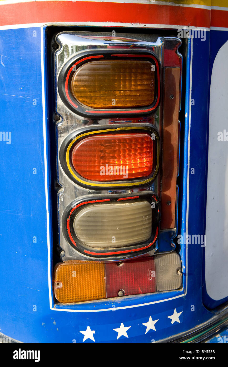 Three colorful brake lights, or tail lights on the back of a chiva, or chicken bus in Cartagena, Colombia. Stock Photo