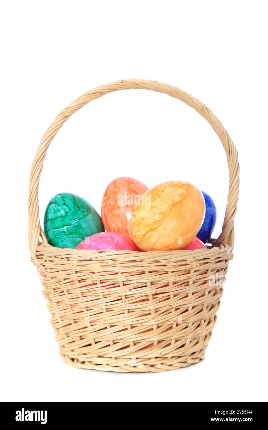 Colored easter eggs in a basket. All on white background Stock Photo ...
