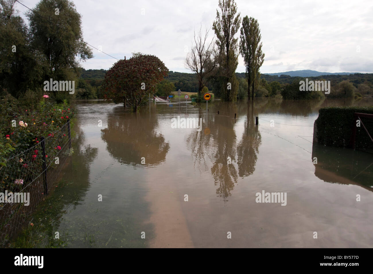 Flooding waters over the roads, fields and gardens after the heavy rain. Stock Photo