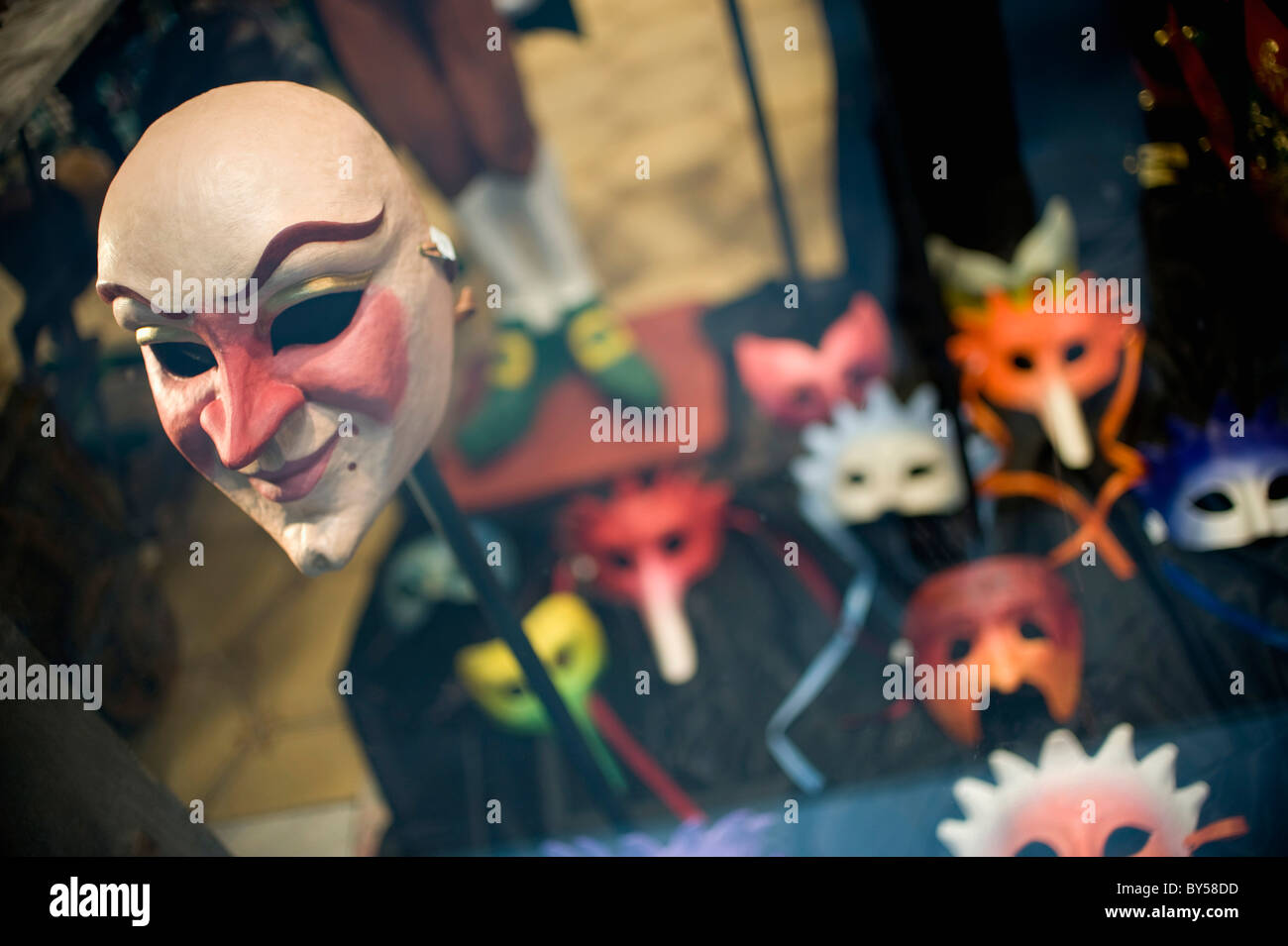 A masquerade mask in a window display Stock Photo Alamy
