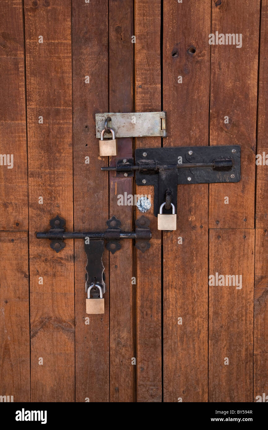 Detail of bolted locks on a wooden door Stock Photo - Alamy