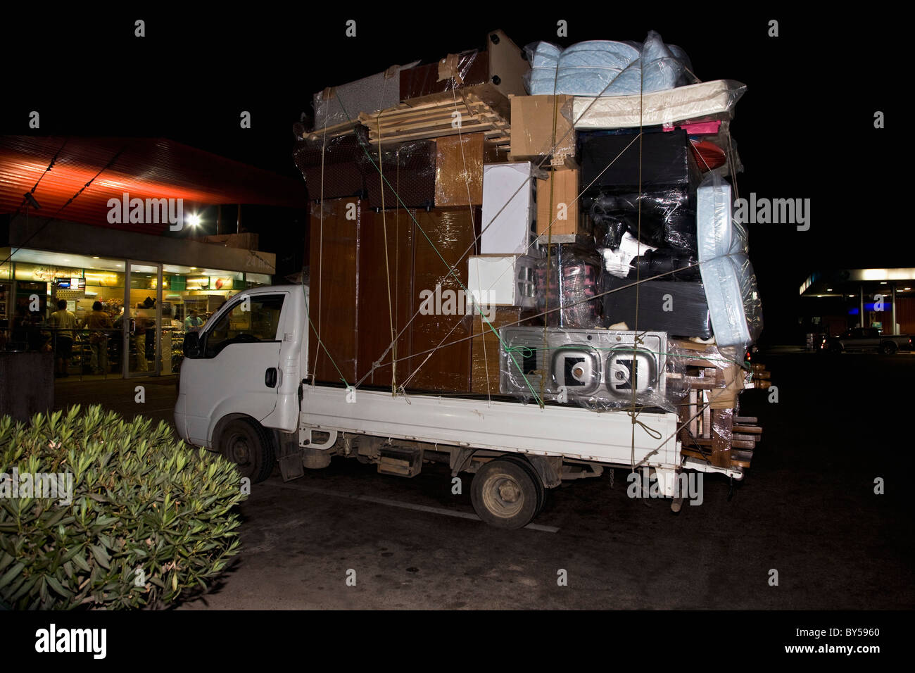 A truck packed with furniture and household items Stock Photo Alamy