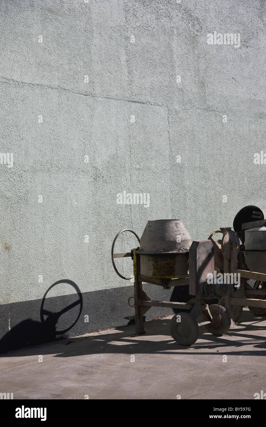 Cement mixers next to a building Stock Photo