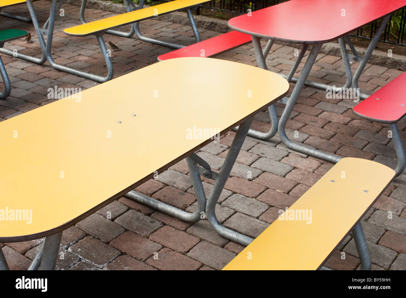 Tables and benches on a patio Stock Photo