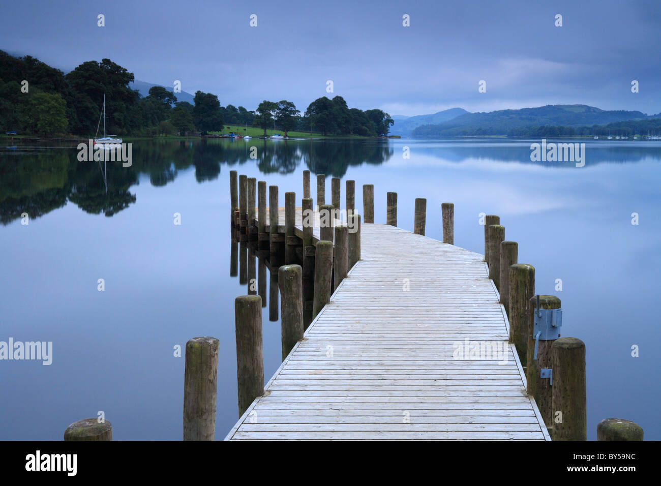Coniston Water jetty Monk Coniston, early morning, still and calm water. Stock Photo
