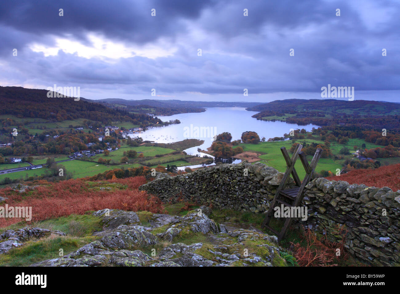 Todd Crag, Wall stile and Lake Windermere stretching into the distance, English Lake District. Stock Photo