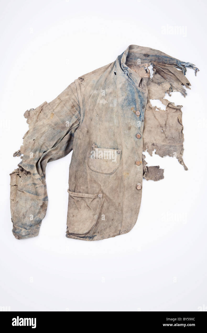 Extremely damaged denim jacket Stock Photo - Alamy