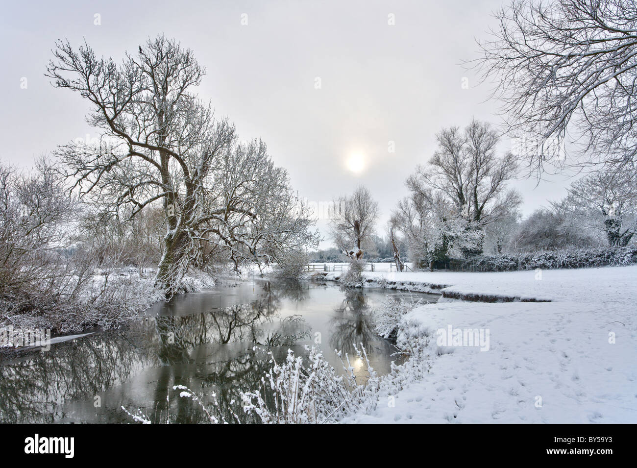River Cam at Grantchester on the outskirts of Cambridge on a cold winter morning. Snow lying on the ground. Stock Photo