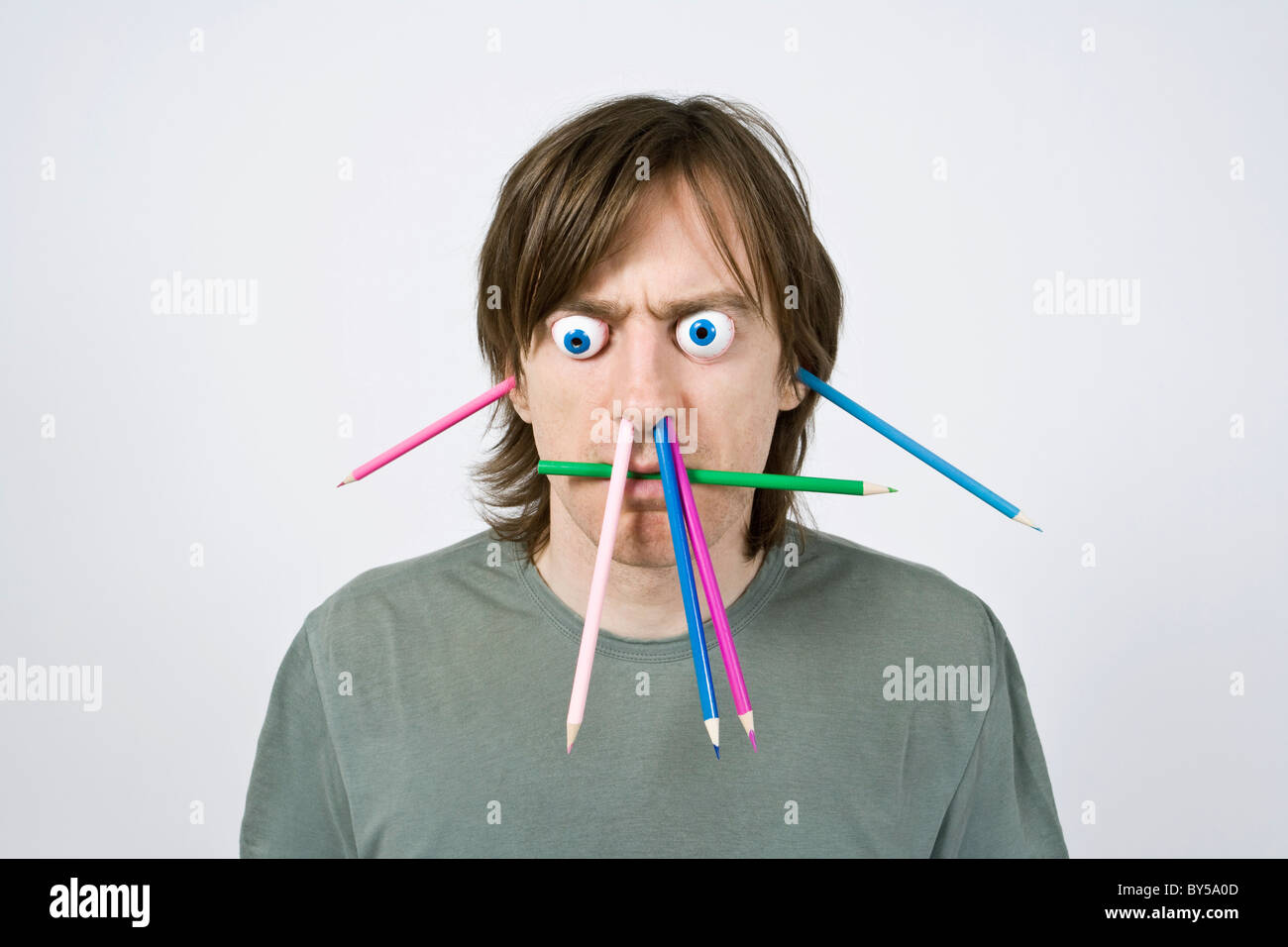 Bizarre man with pencils Stock Photo