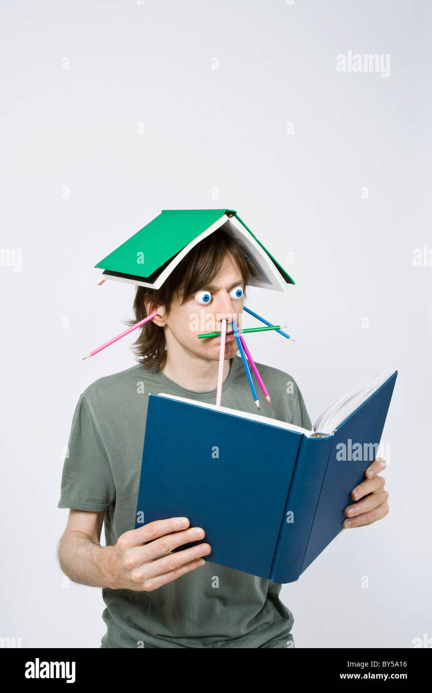 Bizarre man reading a book Stock Photo