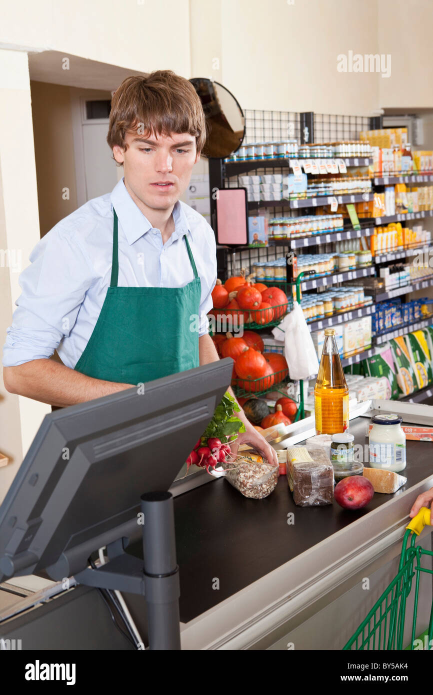 A cashier working in a supermarket Stock Photo