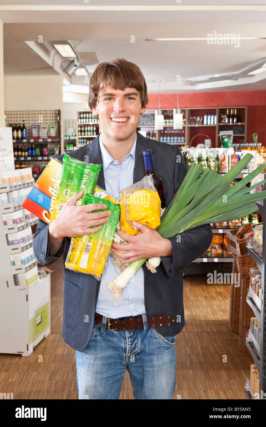 A man with an armful of groceries Stock Photo - Alamy