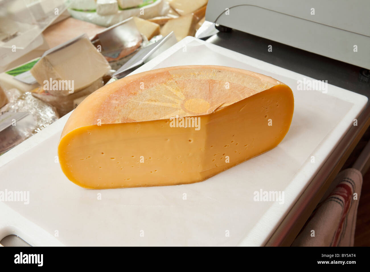A cheddar cheese wheel Stock Photo - Alamy