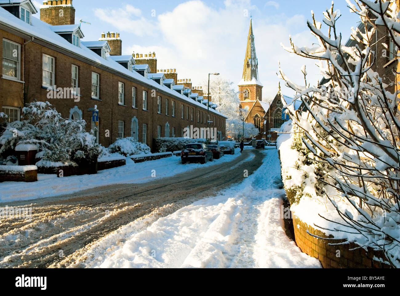 snowy wintry Victorian terraced houses street England UK Stock Photo