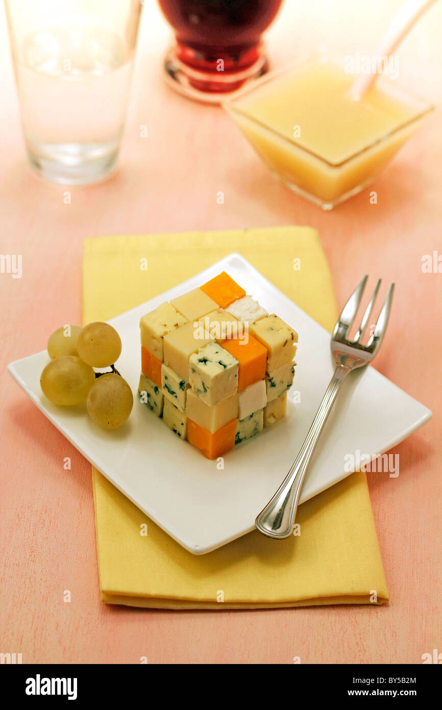 Cheese cube with grape coulis. Recipe available Stock Photo Alamy