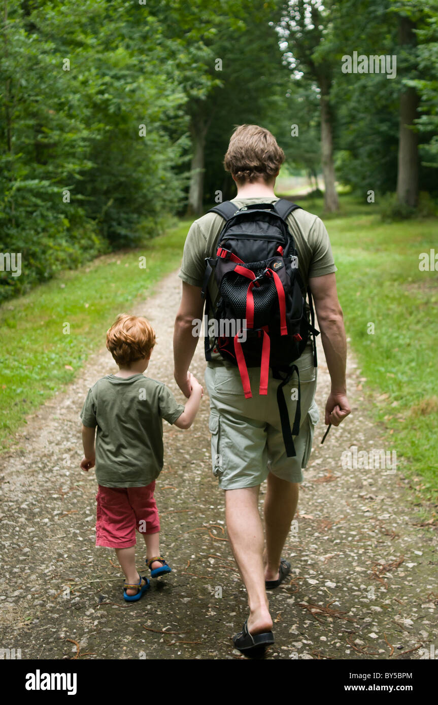 A five year old boy and his dad walking hand in hand Stock Photo - Alamy