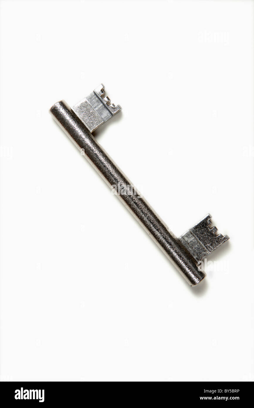 A double-ended key, white background Stock Photo
