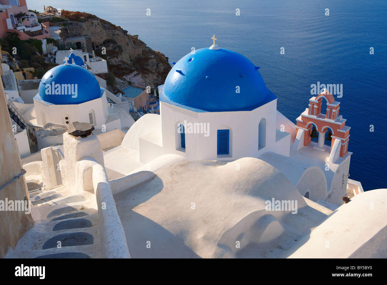 Oia, ( Ia ) Santorini - Blue domed Byzantine Orthodax churches, - Greek Cyclades islands - Photos, pictures and images Stock Photo