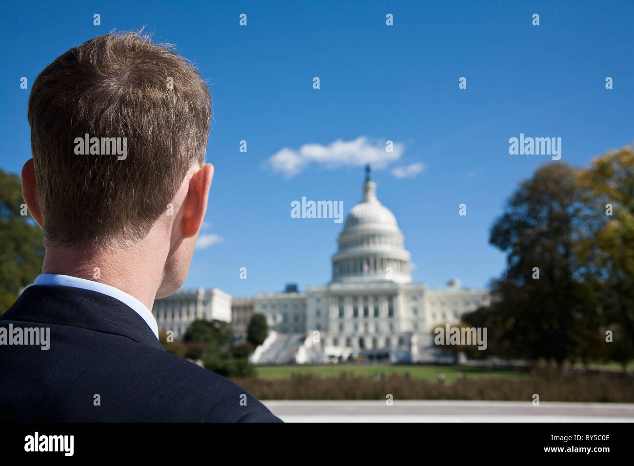A politician in front of the US Capitol Building Stock Photo