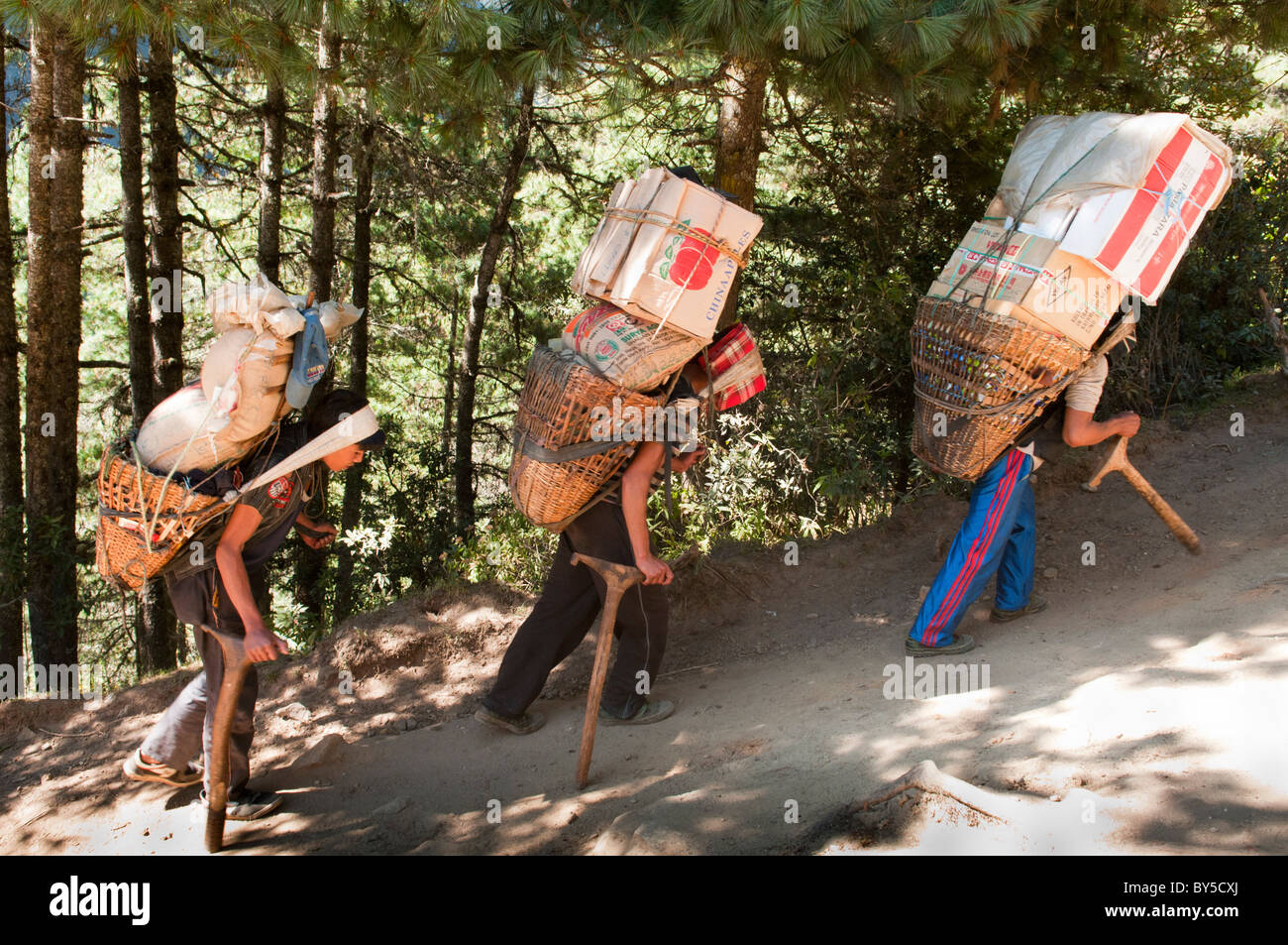 porters on the trail in the Everest Region of Nepal Stock Photo