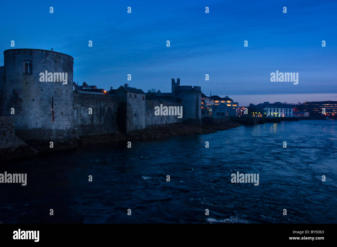 St John's castle over the river Shannon as dusk in Limerick city, Republic of Ireland. Stock Photo