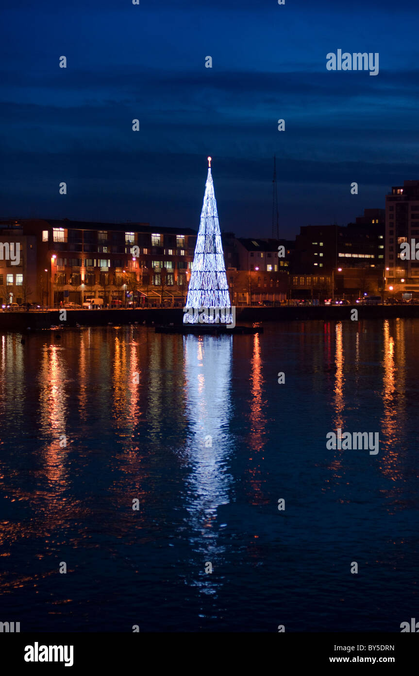 Limerick city skyline after dark on river Shannon with the Christmas