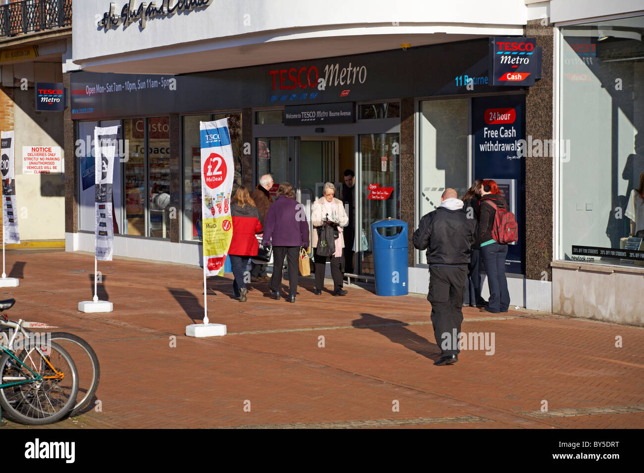 Shopping at the new Tesco Metro, shop front exterior entrance, in Bourne Avenue, Bournemouth Town Centre, Dorset UK in January Stock Photo