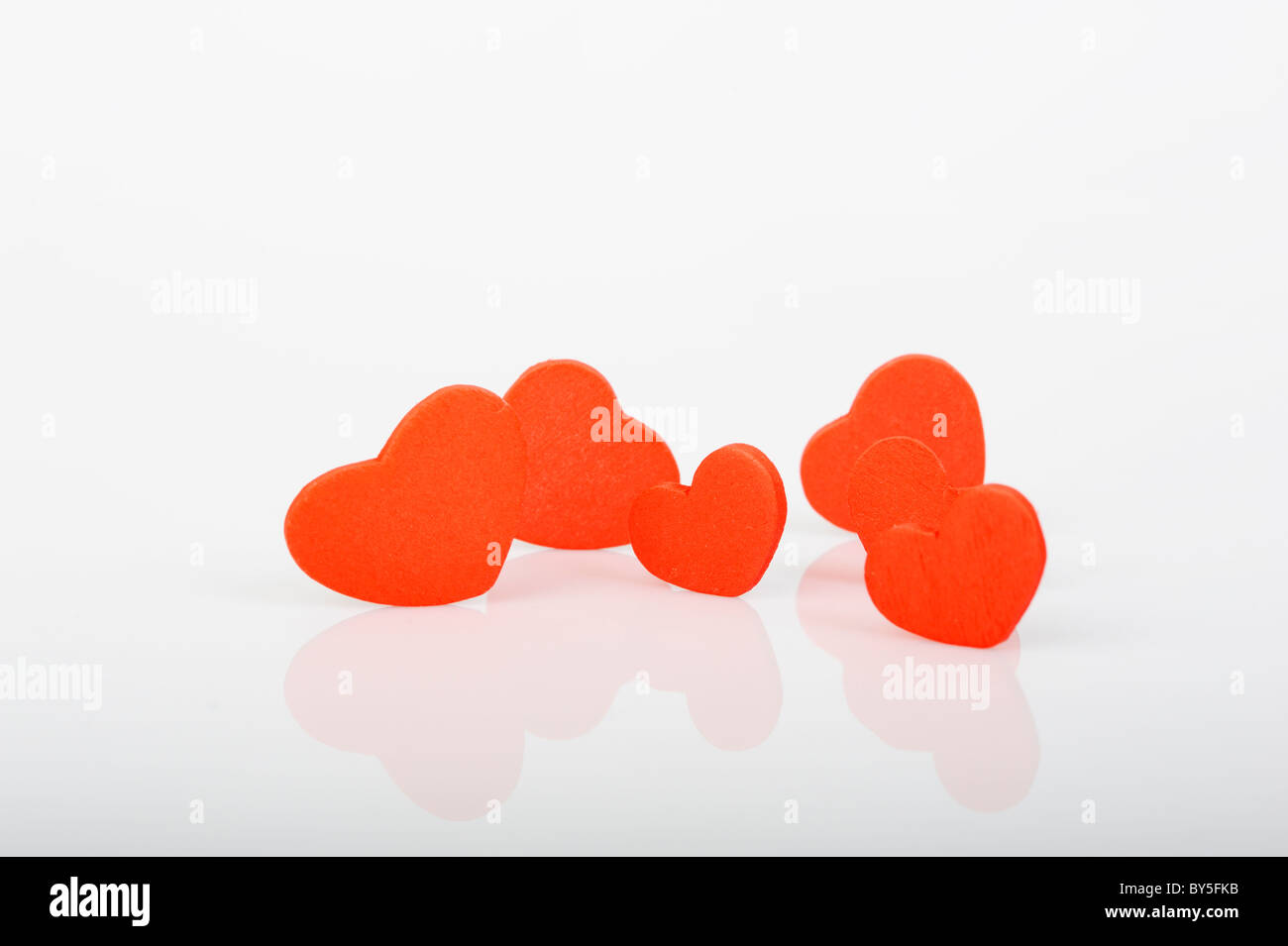 Stock photo red love hearts displayed on a white background. Stock Photo