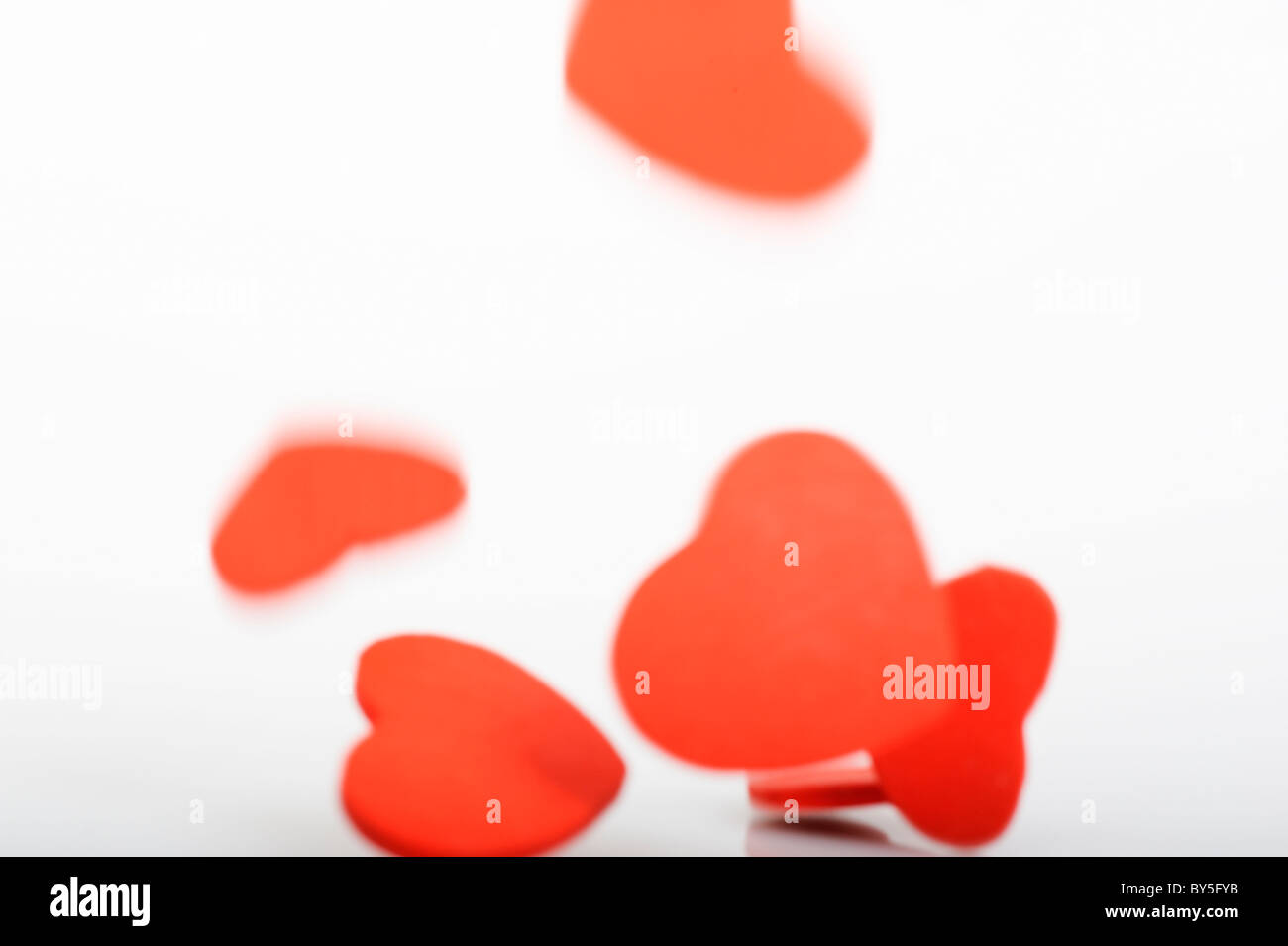 Stock photo red love hearts displayed on a white background. Stock Photo