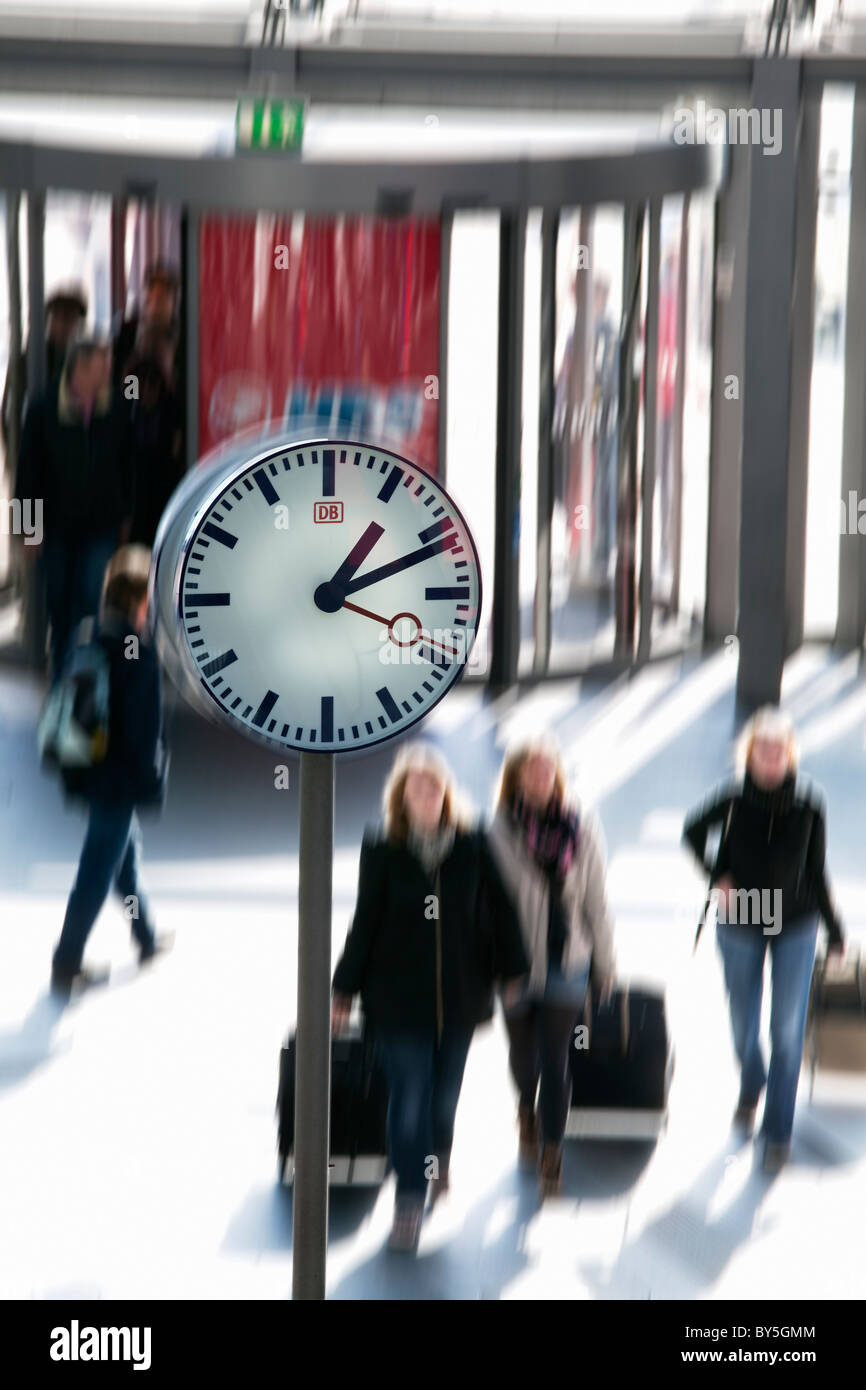 Germany,Berlin, Berlin Central Station, Lehrter Bahnhof, commuters and clock Stock Photo