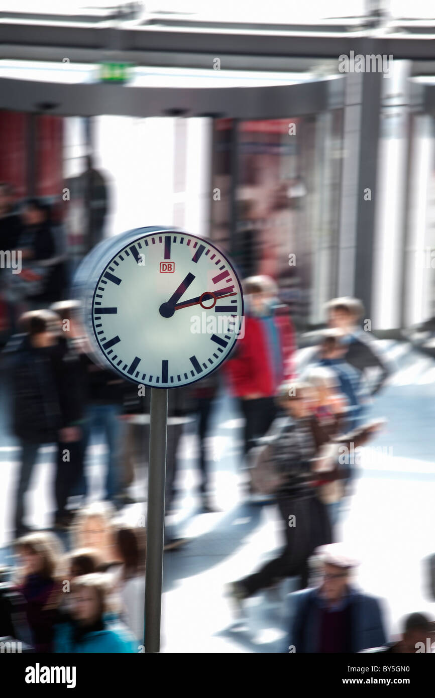 Germany,Berlin, Berlin Central Station, Lehrter Bahnhof, commuters and clock Stock Photo