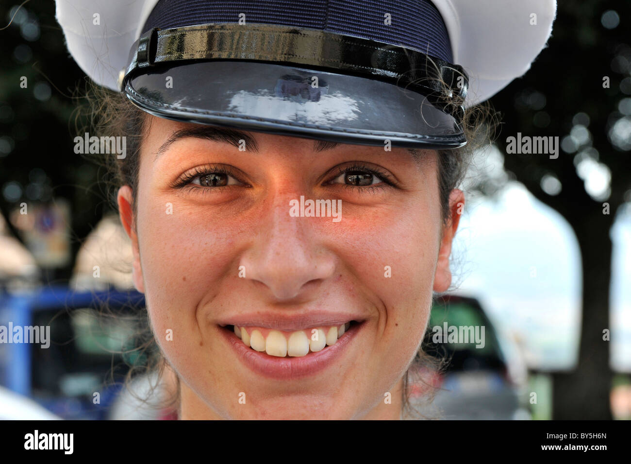 a close up of a smiling Italian female police woman in Cortona, Italy Stock Photo