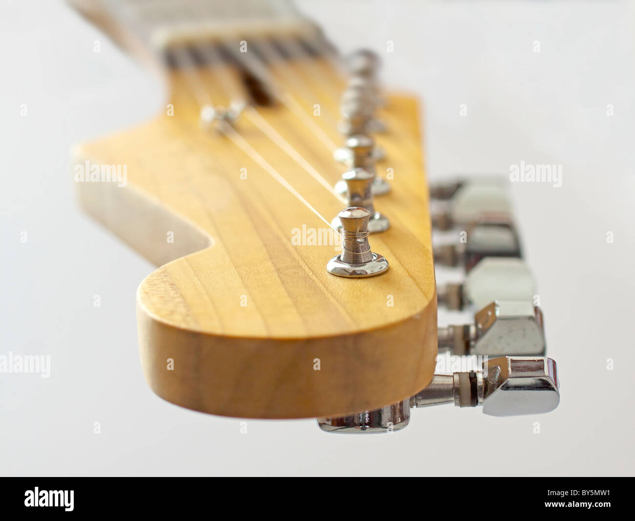 Close up of headstock of an electric guitar, over white Stock Photo