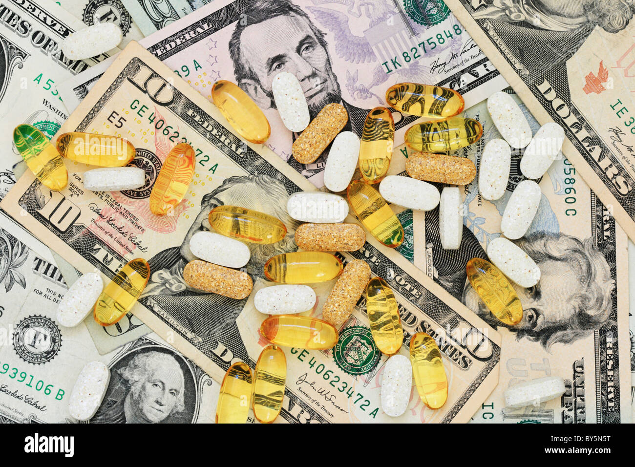 drug pills on a background of US paper money Stock Photo