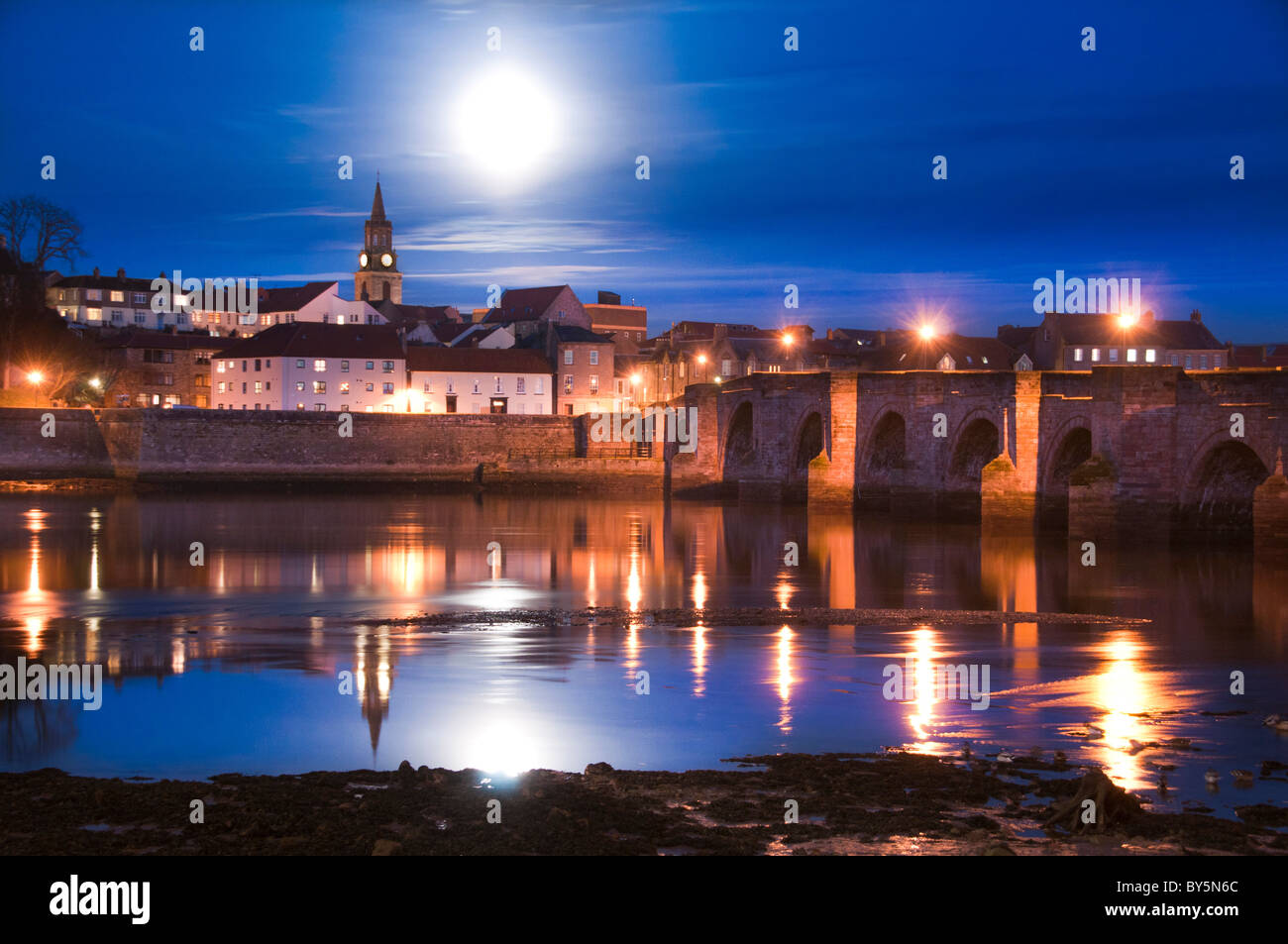 Berwick upon Tweed a night time view of the town and Guildhall from Tweedmouth Stock Photo
