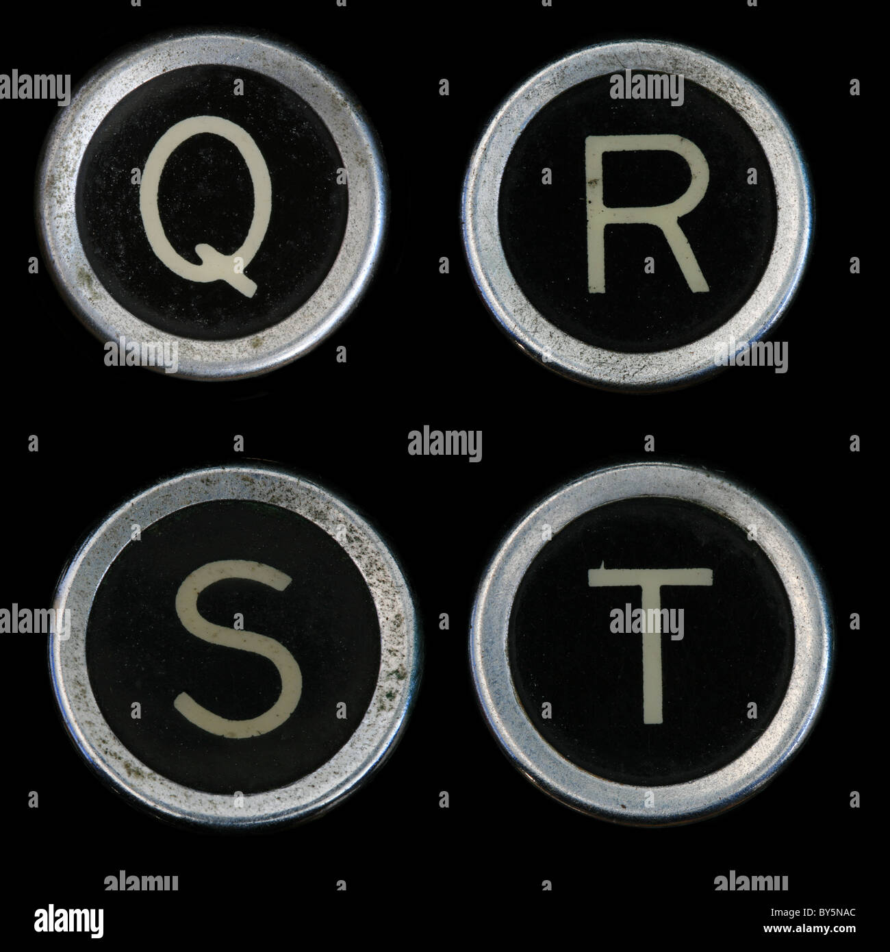 Q R S T keys from old typewriter on black background Stock Photo