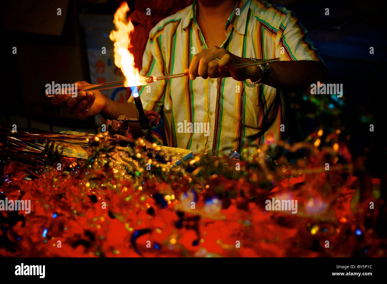man making glass artworks Stock Photo