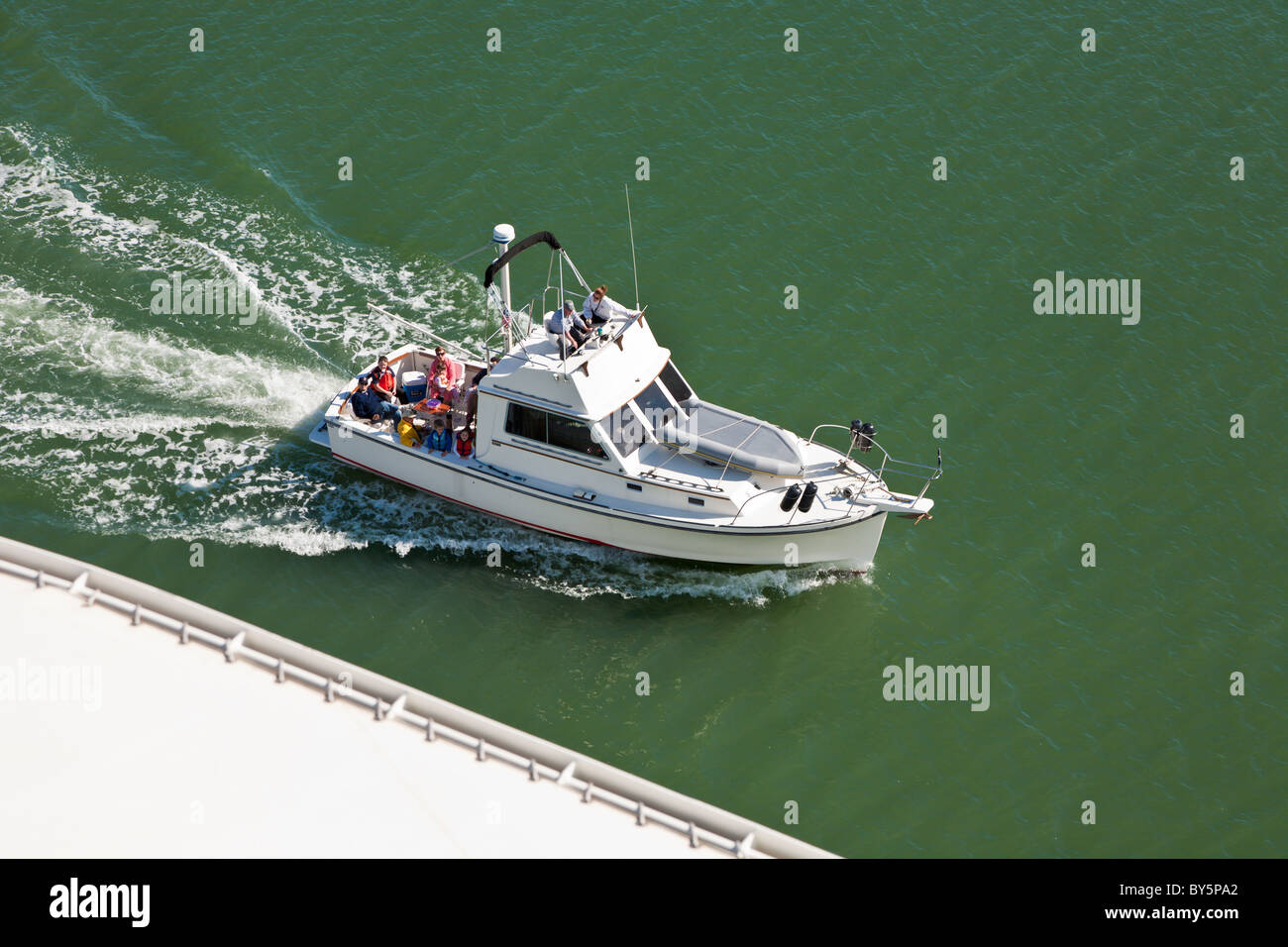 Private fishing boat passing a cruise ship in Boston Harbor, Boston, Massachusetts Stock Photo