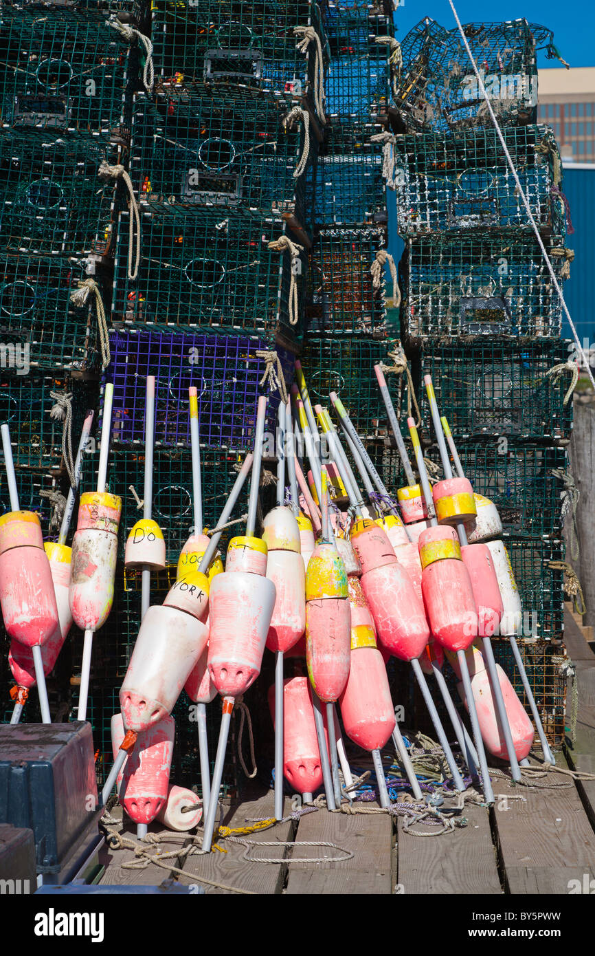 Lobster traps and float bouys stacked on wharf in Portland, Maine Stock Photo