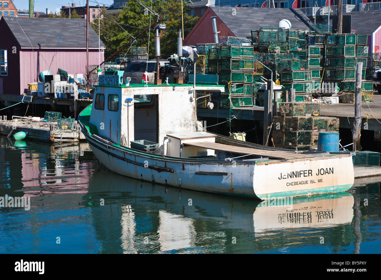 Commercial lobster fishing boats tied to pier in Portland, Maine Stock Photo