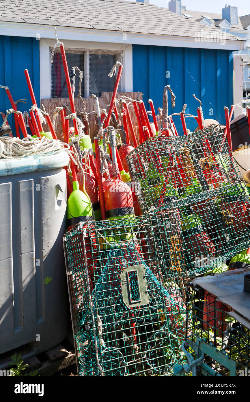 Lobster traps and buoys stacked on wharf in Portland, Maine Stock Photo