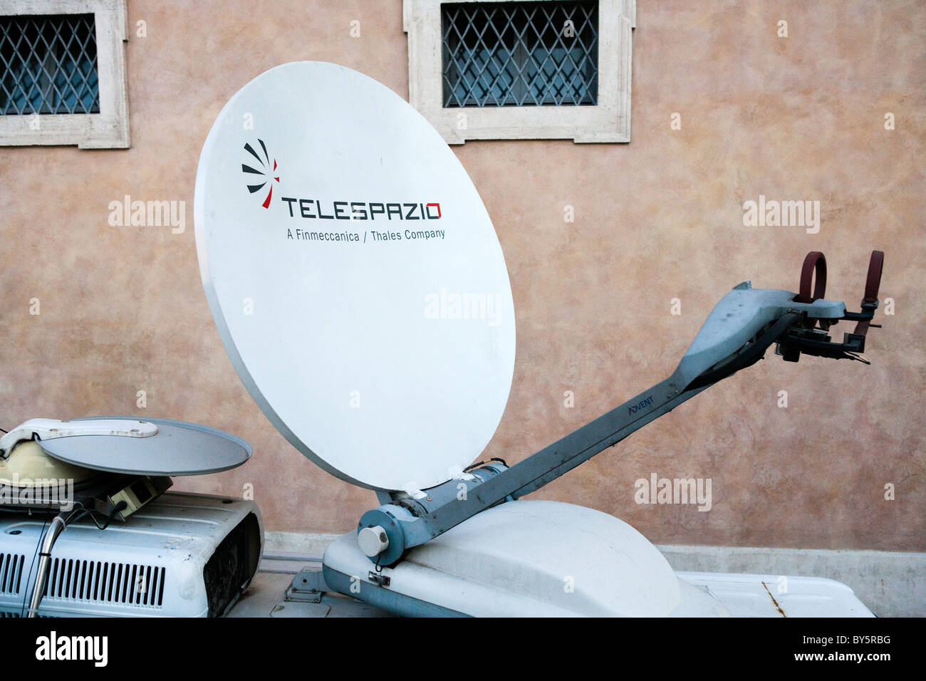 broadcast dish live outside satellite sat mounted on van television tv Italy Rome Italian Stock Photo