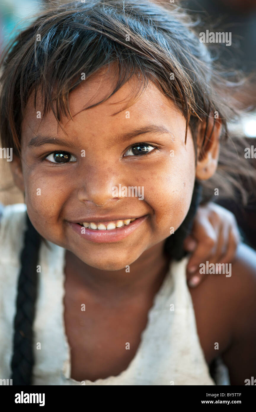 Young poor lower caste Indian street girl from Utter Pradesh smiling Stock Photo