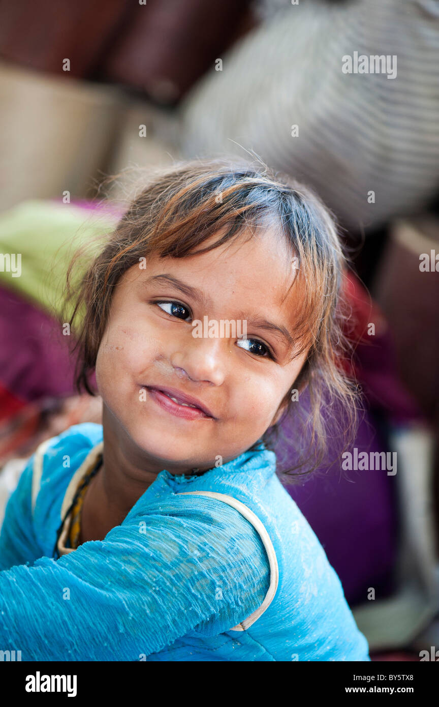 Young poor lower caste Indian street girl from Utter Pradesh smiling Stock Photo