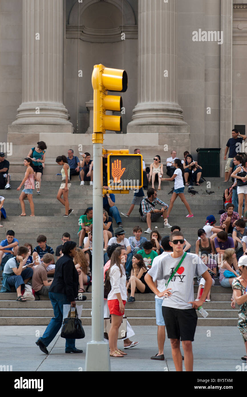 New York City summer time, tourist with 'I Love NY' T Shirt crossing street in front of the metropolitan Museum of Art. Stock Photo